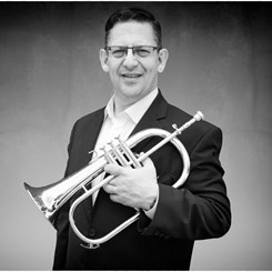 Dr. Jack Wengrosky holding a trumpet